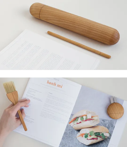 Two publication shots stacked: the wooden rolling pin beside a text page, and the bánh mì recipe spread